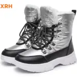 A pair of New Arrivals waterproof, anti-slip PU upper women’s snow boots with adjustable lock lace-up design, fur lining, black laces, thick white soles, and quilted detail is shown against a white background.