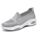 Light gray Fashion Slip on Custom Mesh Sneakers for women featuring a mesh upper, thick white sole, and transparent air cushion heel. OEM/ODM available. Anti-slippery design, ideal for running and sports in 2024.