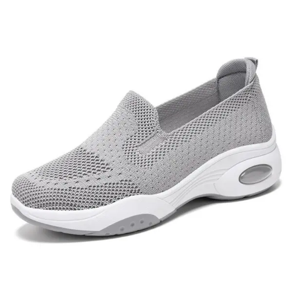 Light gray Fashion Slip on Custom Mesh Sneakers for women featuring a mesh upper, thick white sole, and transparent air cushion heel. OEM/ODM available. Anti-slippery design, ideal for running and sports in 2024.