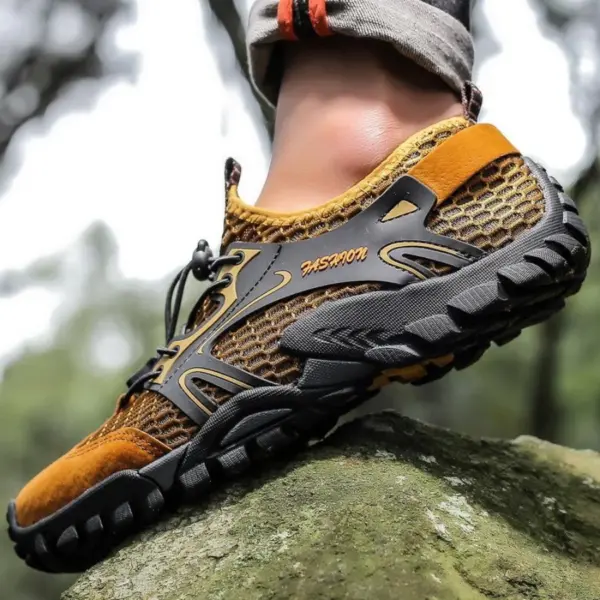 Close-up of a person wearing OEM ODM Wholesale Customized Outdoor Hollow Mesh Hiking Shoes Anti-slip Flats EVA Rubber Water Shoes, standing on a mossy rock outdoors.