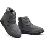 Low price women's black leather winter boots with high tops and flat heels, set against a white background—ideal for OEM and ODM wholesale orders.
