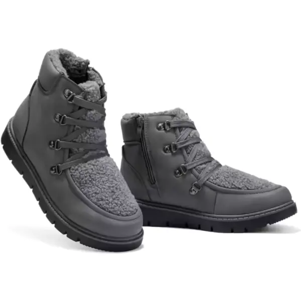 Low price women's black leather winter boots with high tops and flat heels, set against a white background—ideal for OEM and ODM wholesale orders.