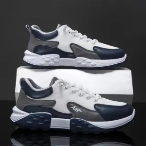 A pair of ODM wholesale mixed-color low-top vulcanized canvas shoes with thick soles and laces—ideal for plus sizes and customized OEM or ODM branding for your business.