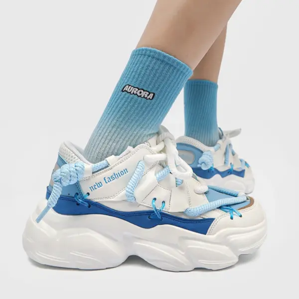 A person wears 2024 Fashion Breathable Mesh Casual Wholesale Sports Running Sneaker Fitness Walking Style Shoes for Men in white and blue, featuring light blue laces and "AURORA" socks—perfect for OEM/ODM customization needs.
