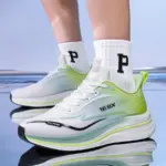 A person wearing High Quality Men Sneakers Cushioning Mesh Thick Bottom Soft Sole Basketball Style Shoes Sneaker for Men 2024 in white and green with "168X" branding and white socks with a large black "P", standing on a reflective surface.