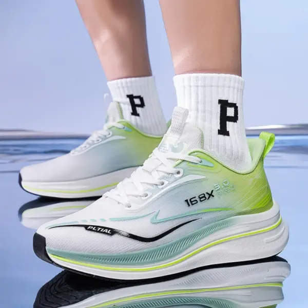 A person wearing High Quality Men Sneakers Cushioning Mesh Thick Bottom Soft Sole Basketball Style Shoes Sneaker for Men 2024 in white and green with "168X" branding and white socks with a large black "P", standing on a reflective surface.