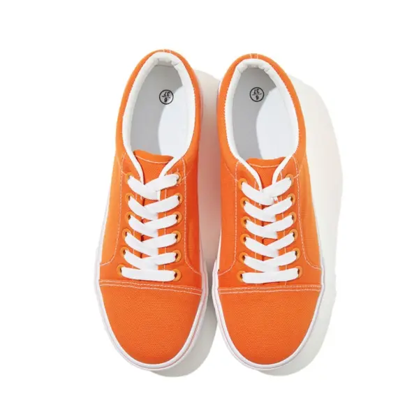 The XRH Wholesale Custom Logo Canvas Sneaker showcases classic men's casual fashion in orange with white laces and soles, viewed from above on a white background—ideal for OEM and ODM customization.