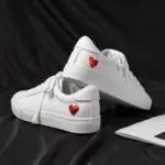 Xrh Wholesale Spring PU Valentine's Day Gift Love Custom Shoes—white women's low top vulcanized shoes with red heart patches, ideal for OEM/ODM customization.