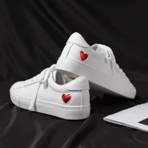 Xrh Wholesale Spring PU Valentine's Day Gift Love Custom Shoes—white women's low top vulcanized shoes with red heart patches, ideal for OEM/ODM customization.