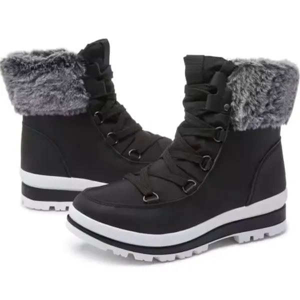 A pair of black leather sports ankle sneakers boots with gray faux fur trim, white soles, and black laces—perfect for OEM/ODM customization. Wholesale customizable logo options available; ideal women’s snow waterproof outdoor warm boot.