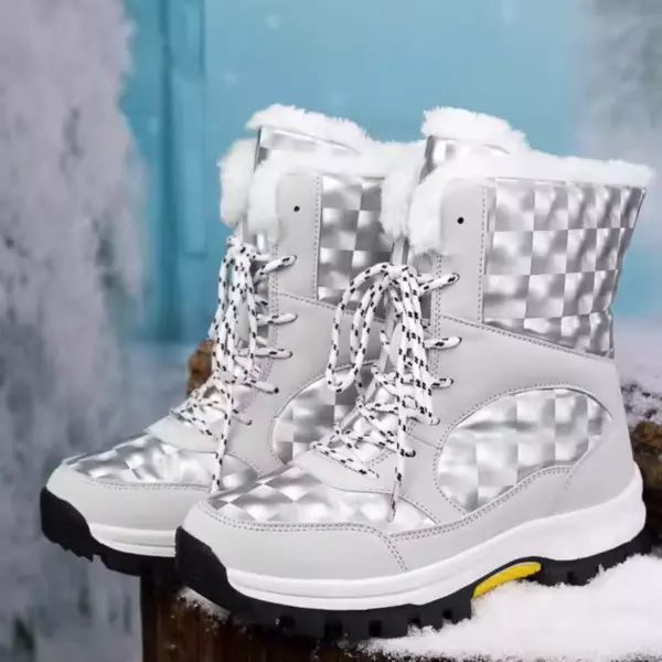 A pair of 2024 Customized LOGO Pattern Style Autumn Winter Trendi Warm Snow Boots with mixed PU and cotton, silver and white checkered design, faux fur lining, black rubber soles on a snowy surface.