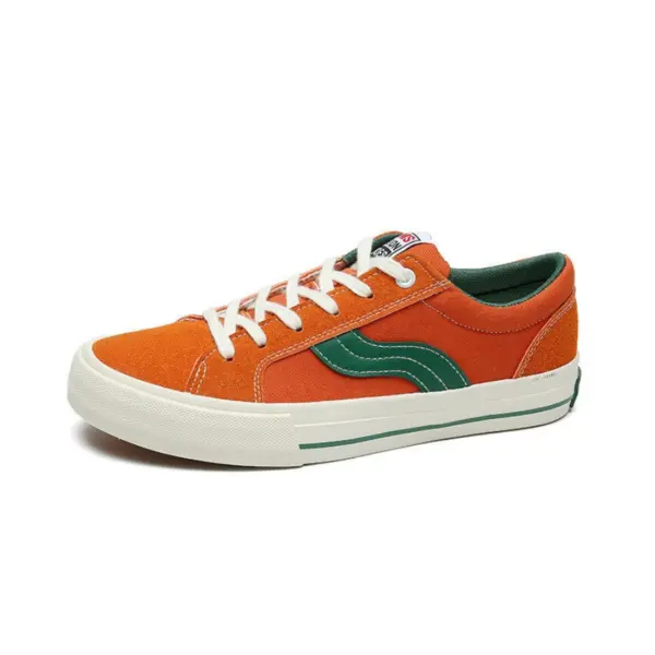 Introducing our OEM ODM Factory Wholesale Customized PU Rubber Canvas Shoes—orange low-top sneakers with white laces, green side stripe, and a white sole with green detail. Ideal for sports or casual use, and perfect for customization.