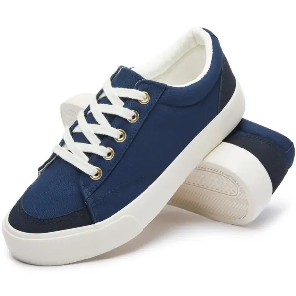 A pair of Classic Denim Upper Lace-Up Round Toe Men's Casual Sport Walking Canvas Shoes with OEM/ODM options, one shoe propped against the other on a white background.