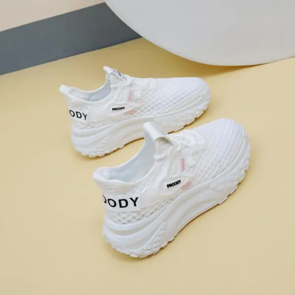 A pair of 2025 summer low-price mesh round toe sneakers, slow walking lace-up women's shoes, shown on a light yellow surface—ideal for OEM and ODM customization.