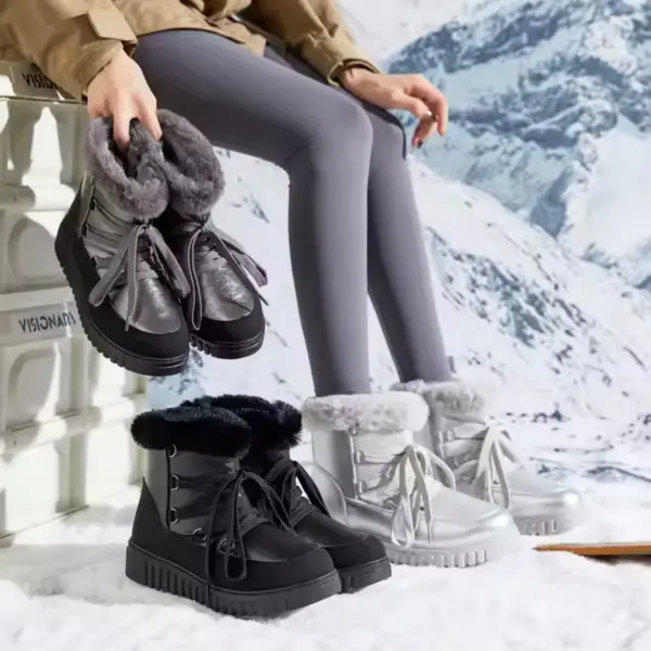 A person in gray leggings sits on a white bench in the snow, holding Fashion Leather Ladies Winter Snow Hiking Boots; black and silver pairs of these waterproof outdoor boots are placed on the ground nearby.