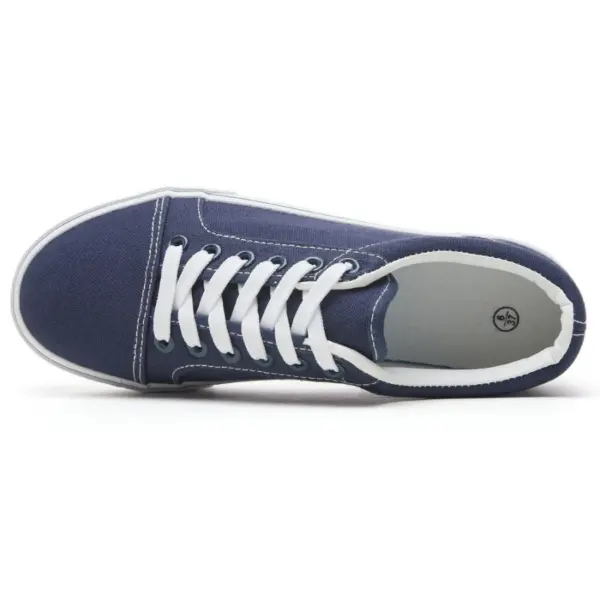 The XRH Wholesale Custom Logo Canvas Sneaker, a classic men's casual fashion shoe in navy blue with white laces and sole, is shown from above on a white background—perfect for OEM/ODM customization.