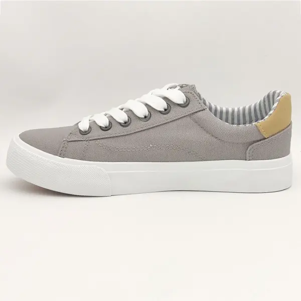 New Arrivals Wholesale Band Vulcanized Fashion Leather Casual Canvas Shoes for Men—a gray sneaker with white laces, white sole, and beige heel accent. OEM & ODM options available, shown on a plain white background.