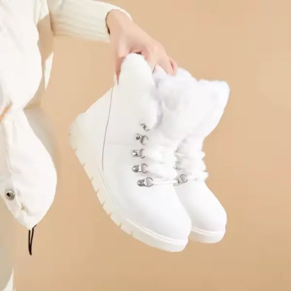 A person in a white jacket holds the 2025 Colorful Boots Women Shoes—fashion faux suede, plush-lined snow ankle boots for ladies—in white with silver eyelets against a beige background.