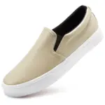 A beige waterproof PU upper slip-on flat shoe with an elastic band, white rubber sole, and black inner lining is shown at a slight angle on a white background. Product: Fashionable Casual Walking Shoes for Women.