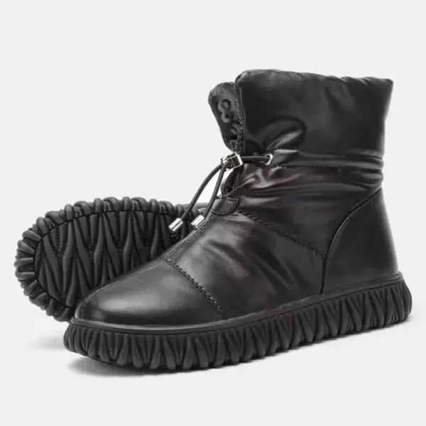 A pair of black plush, thick genuine leather waterproof fur boots with drawstring closure and textured rubber soles—perfect for OEM/ODM customization as women's snow winter boots.