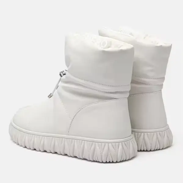 A pair of wholesale OEM/ODM plush thick genuine leather waterproof bread cotton fur winter boots for women, shown from the back and side, featuring textured rubber soles and a slightly slouched upper—perfect for customization.
