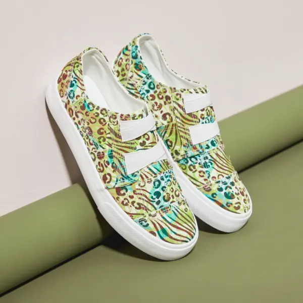 A pair of XRH Wholesale Cheap Price Pink Slip on Women's Casual Canvas Shoes for Women New Style 2025 is displayed against a green and beige background.