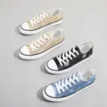 Three pairs of Wholesale Custom Made Blue Walking Style Canvas Shoes for women, featuring white laces and soles, are arranged on a light gray background.