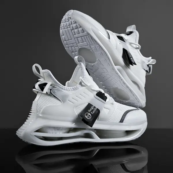 Wholesale breathable athletic running sneakers for men—fashionable white shoes with black accents and chunky soles, displayed on a dark background. Ideal for brands seeking OEM/ODM manufacturing solutions in fitness and casual sports footwear.
