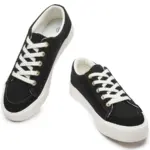 A pair of Wholesale Custom Classic Denim Upper Lace-Up Round Toe Men's Casual Sport Walking Canvas Shoes, black with white soles and laces, displayed on a white background.