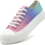 The ODM Wholesale Mixed Colored Low Top Vulcanized Canvas Shoes feature white laces, a thick white sole, and a pink, purple, and teal gradient upper—plus size flats available for OEM/ODM customization.