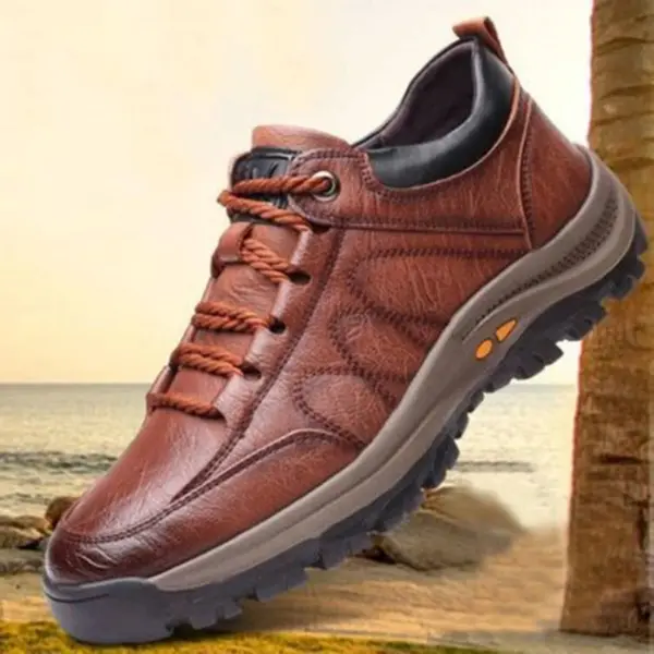 The Men's Solid Faux Leather Lace Up Shoes for men, high-quality sneakers designed for daily life, are shown outdoors near a beach and palm tree.