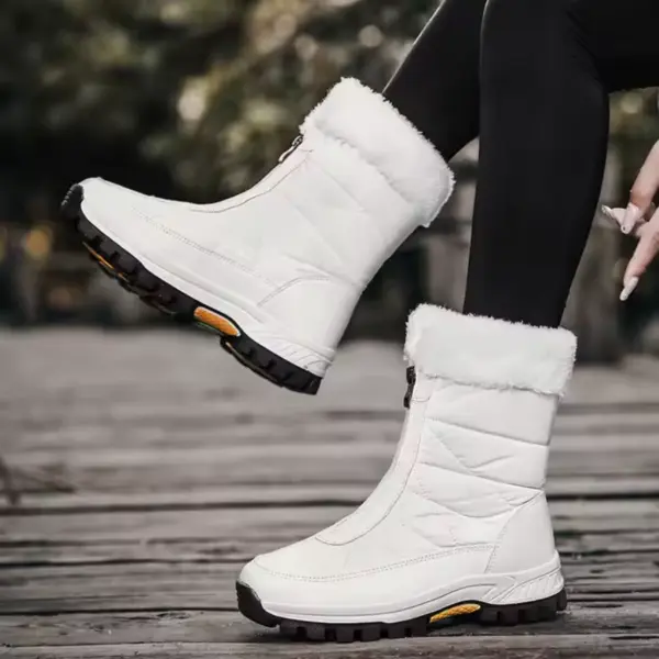 A person wearing 2025 Spring Wenzhou Factory Zipper Women Casual Waterproof Fur Winter Outdoor Medium Snow Boots, featuring stylish fur trim and black soles, sits outdoors in black leggings—perfect for showcasing chic footwear.
