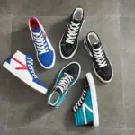 Five pairs of 2024 Fashion Breathable Mesh Casual Running Sneakers for Men—fitness walking style, in blue, black, and teal—are displayed on a gray tiled floor; available for OEM or ODM orders.