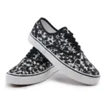 A pair of 2025 Factory New Style Mixed Trendy Adult Canvas Shoes for women, featuring black laces and a black-and-white abstract pattern on the fabric upper, displayed against a white background.