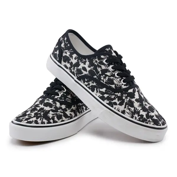 A pair of 2025 Factory New Style Mixed Trendy Adult Canvas Shoes for women, featuring black laces and a black-and-white abstract pattern on the fabric upper, displayed against a white background.
