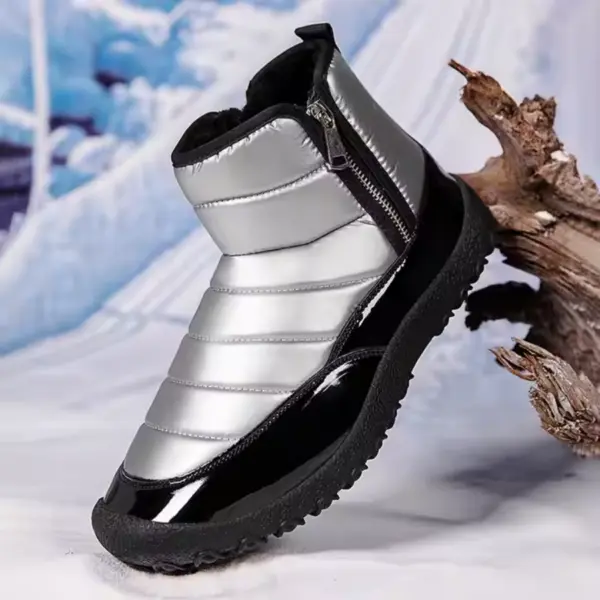 The New Down Fabric Waterproof Snow Boots for men, featuring double zippers, a ridged sole, and thickened cotton lining, are available for OEM ODM orders and displayed propped against wood in a snowy setting.