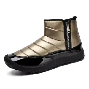 Wholesale shiny gold cotton TPR snow boots with round toe, padded upper, black glossy toe cap, textured black sole, and side zipper—customizable for OEM/ODM winter men’s and women’s orders.