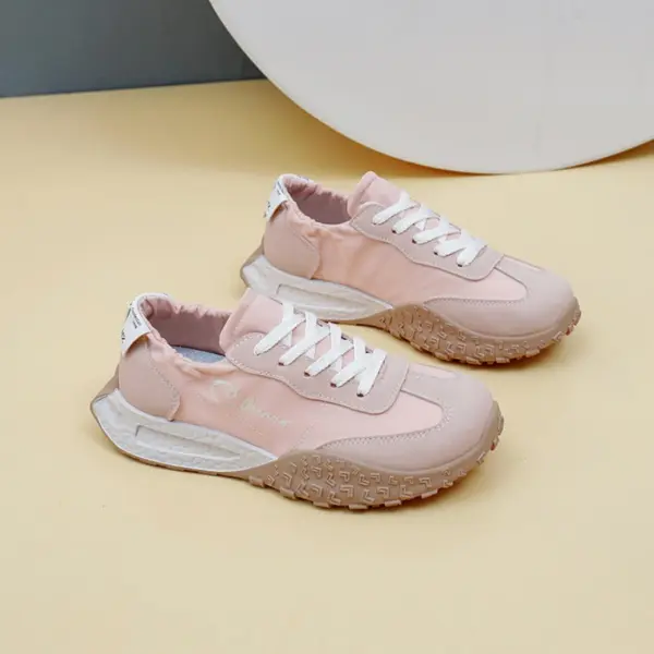 A pair of New Mesh Breathable Sports Sneakers Summer PU Women's Rubber Lace up Shoes in light pink with white laces and textured beige soles, displayed on a beige surface.