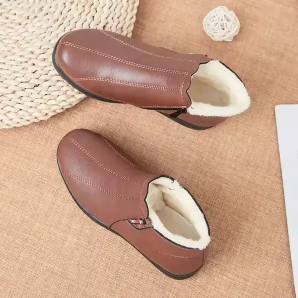Women’s waterproof snow boots with zipper, leather upper, cotton fur lining, and non-slip sole—perfect for OEM/ODM customization.