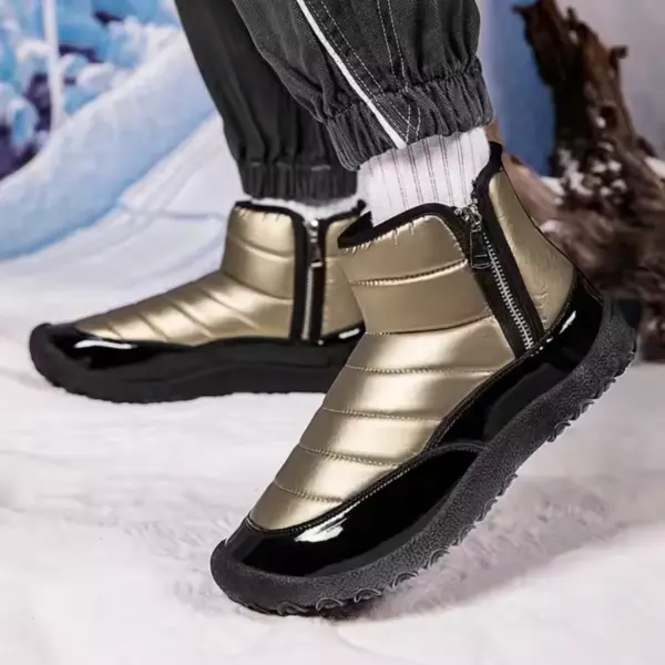 Person wearing Wholesale New Fashion Outdoor Shiny Cotton TPR Snow Boots with zipper and round toe, standing on snow against a winter backdrop. Suitable for men and women, featuring thick soles for outdoor use.