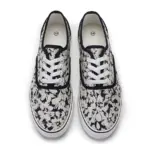 2025 factory new style mixed trendy adult canvas sneakers for women, shown from above with an abstract black and white floral pattern, white laces, and black trim—perfect for OEM/ODM customization.