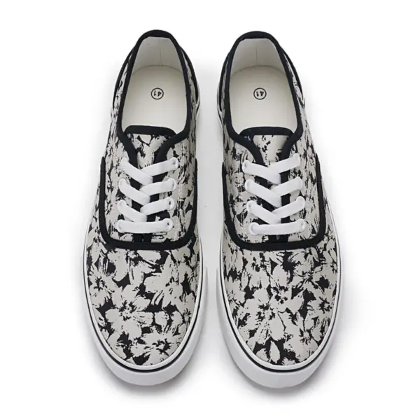 2025 factory new style mixed trendy adult canvas sneakers for women, shown from above with an abstract black and white floral pattern, white laces, and black trim—perfect for OEM/ODM customization.