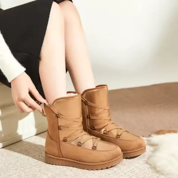 A person indoors adjusts the 2025 New Winter Round Toe Chunky Heel Leather Boots for Women, wearing a black skirt and white sweater. Carpet and part of a furry rug are visible on the floor.