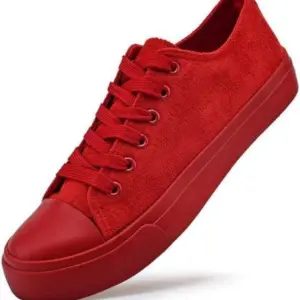 A Wholesale Factory Painted Plush Solid Canvas Shoe in red with matching laces and a rubber sole, displayed on a white background—perfect for OEM or ODM customization.