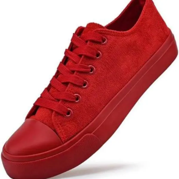 A Wholesale Factory Painted Plush Solid Canvas Shoe in red with matching laces and a rubber sole, displayed on a white background—perfect for OEM or ODM customization.