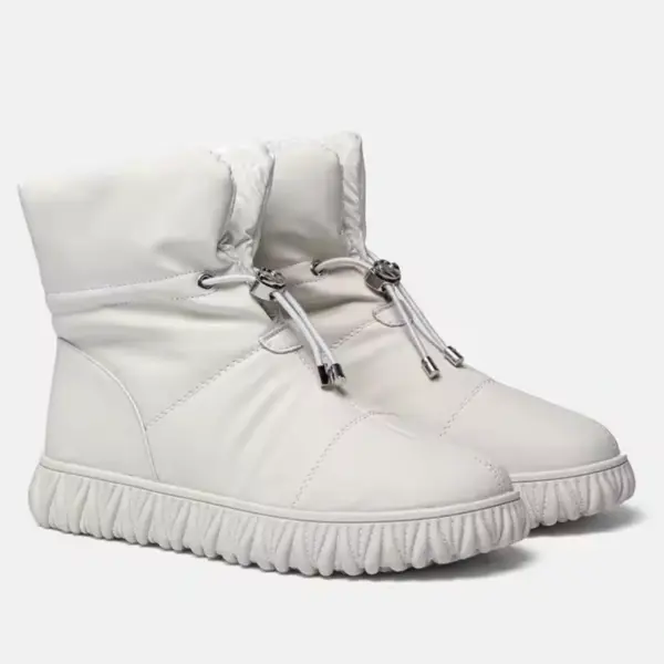 Wholesale OEM/ODM plush thick genuine leather waterproof snow boots for women, featuring quilted cotton fur uppers, drawstring closures, and textured rubber soles—ideal for winter and customizable for your brand.