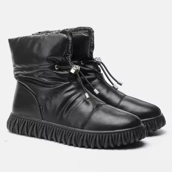 A pair of wholesale customized plush thick genuine leather waterproof bread cotton fur boots, designed for women, with OEM/ODM options—perfect snow winter boots featuring quilted uppers and drawstring closures.