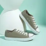 Hot Sale customizable women's fashionable PU upper canvas shoes with lightweight white soles and toe caps, shown on a mint green surface with a modern white prop—ideal for OEM/ODM orders.