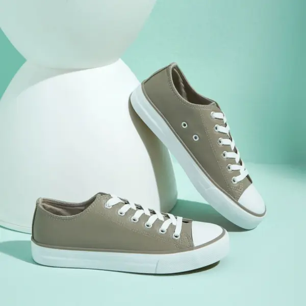 Hot Sale customizable women's fashionable PU upper canvas shoes with lightweight white soles and toe caps, shown on a mint green surface with a modern white prop—ideal for OEM/ODM orders.