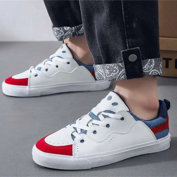 A person wearing Customizable Retro Mixed Stylish Plush Walking Sneakers—lightweight, breathable women’s shoes—paired with black jeans that have patterned cuffs.